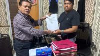 Abraham Mambu, saat melaporkan kasus dugaan penyerobotan tanah di Polres Minahasa